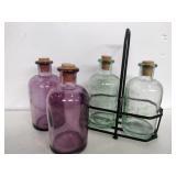 Purple and green glass bottles