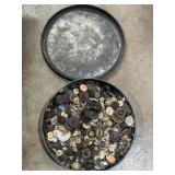 Round tin full of buttons