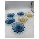 Four blue candlesticks, two amber color