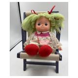 Pretty as a picture ragdoll with wooden chair.