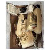Three old telephones, two are rotary dial