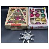Shiny glass Christmas ornaments and candle holder