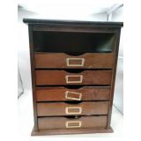Wooden organizer with drawers lots of shiny rocks