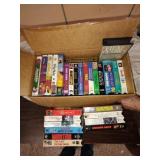 Box of VHS tapes: some Disney.