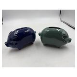 Two ceramic pigs, one dark blue, one light blue 6