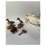 Goose and loon figurines, wooden pig, candle