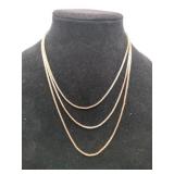Gold tone three tier necklace