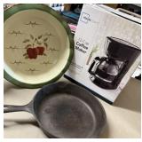 Coffee maker, large pie dish, cast iron skillet