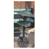 Metal birdhouse stand with cast  bird