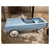 Older blue metal pedal car