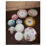 Large group of vintage ceramic plates and bowls.