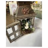 decorative lantern features a distressed wood