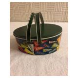 Oblong, green metal lunchbox sewing box button