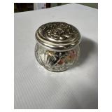 Marble collection in glass jar with metal lid