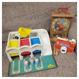 Group of old fisher price toys.
