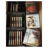 Various music CDs and CDs in a plastic rack