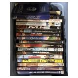 Tub of action DVDs and coin books, blue book, &