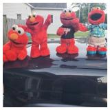 Group of vintage talking and dancing elmos.