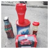 Group of coca cola items.