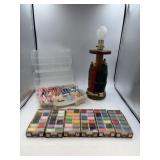 Spool lamp, six boxes of thread, container of