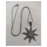 Silver snake chain starfish pendant marked 925.