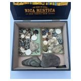Mix of geodes, artifacts, rocks in wooden cigar