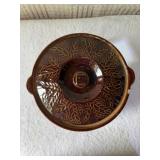 Think vintage brown glaze, stoneware casserole
