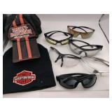 Two Harley-Davidson hats and riding glasses