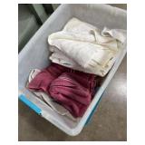 Towels and washcloths in tote with lid