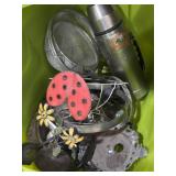 Old thermos, metal strainers, metal ladybug