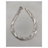 Silver braided bracelet marked 925.    .280oz