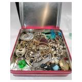 Tin with mixed jewelry