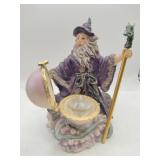 Wizard holding dragon topped  staff with Crystal