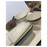 Enamelware casserole dish with lid, pots, and