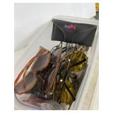 Variety of sunglasses and readers in tote