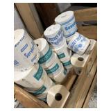 Older brands of  toilet tissue rolls in a wooden