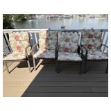 Four patio chairs with four cushions. Chairs are