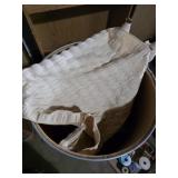 Vintage Cloth Blinds in a barrel with a shower