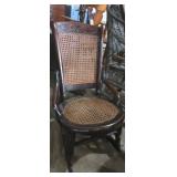 Woven back children's armless rocking chair