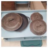 Cast iron skillet and random lids.