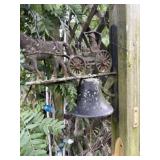 Small cast-iron bell featuring a horse and buggy