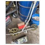 precision garden seeder and roll of mulch film