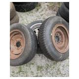 2 R15 and 1 R16 vehicle tires on rims