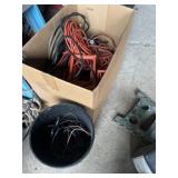 Large box of extension, cords, and bucket of