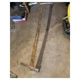 2 buck saws one with handles one without