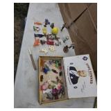 Plastic toys and figures  in a cigar box