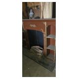 Faux fire place mantle with fake lighted logs