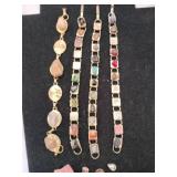 Gold tone bracelets with shining rocks missing