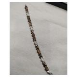 Silver Hearts & X bracelet marked 925.   .220oz