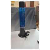 blue glitter motion lamp features a sleek black